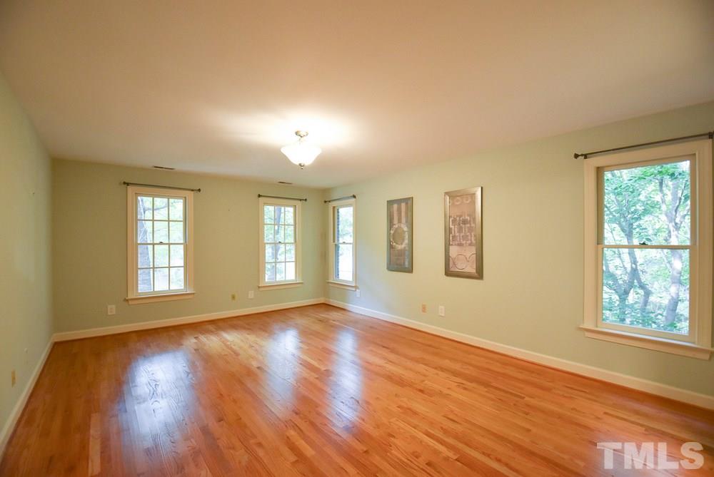 9004 Enfield Court Raleigh, NC 27615 - Photo 17 of 30 Very spacious Master Bedroom w/hardwood floor, lg WIC, lots of windows & updated private Bath.