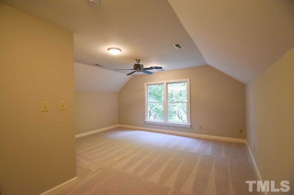 9004 Enfield Court Raleigh, NC 27615 - Photo 24 of 30 Lg 3rd floor Bedroom 4 w/neutral carpet, lg closet & CF; nearby unfinished WI Attic storage area; cement-floored WI crawl space adds more storage space.