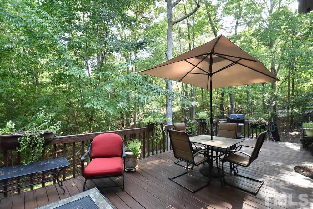 9004 Enfield Court Raleigh, NC 27615 - Photo 25 of 30 Huge Deck off Kitchen & Family Rm overlooks very private backyard.
