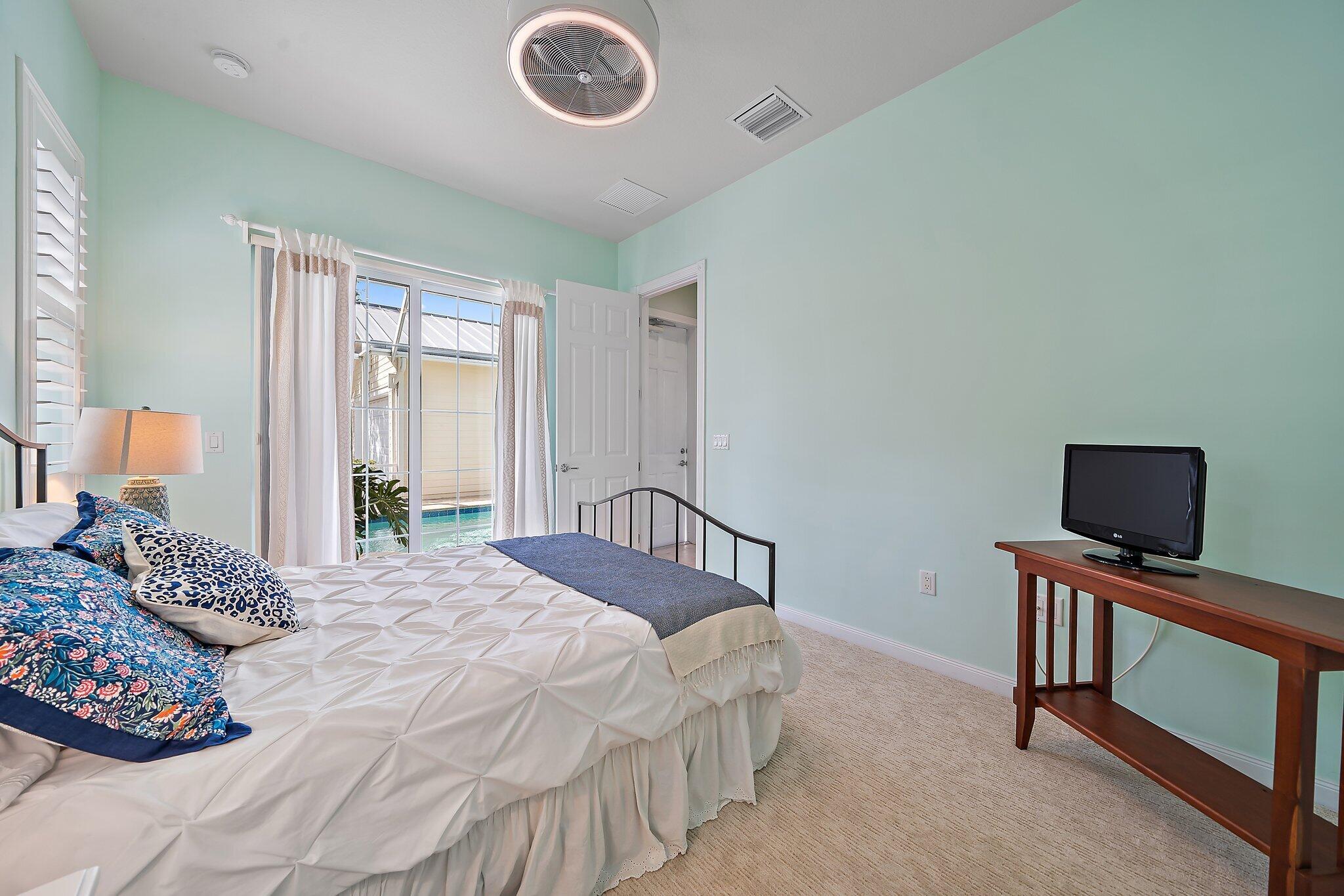 1174 Tropical Drive Jupiter, FL 33458 - Photo 38 of 49 Guest Ensuite Pool Access