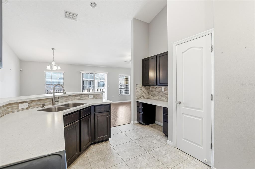 5723 Kingletsound Lithia, FL 33547 - Photo 20 of 33 a kitchen with a sink stove and refrigerator