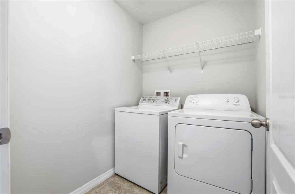 5723 Kingletsound Lithia, FL 33547 - Photo 30 of 33 a utility room with dryer and washer