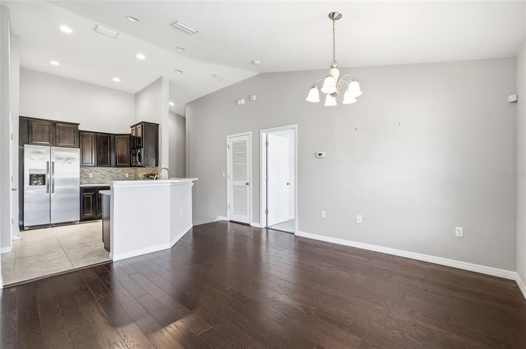 5723 Kingletsound Lithia, FL 33547 - Photo 8 of 33 a view of a kitchen with a sink wooden floor and a kitchen