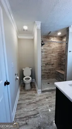 a bathroom with a sink and a toilet