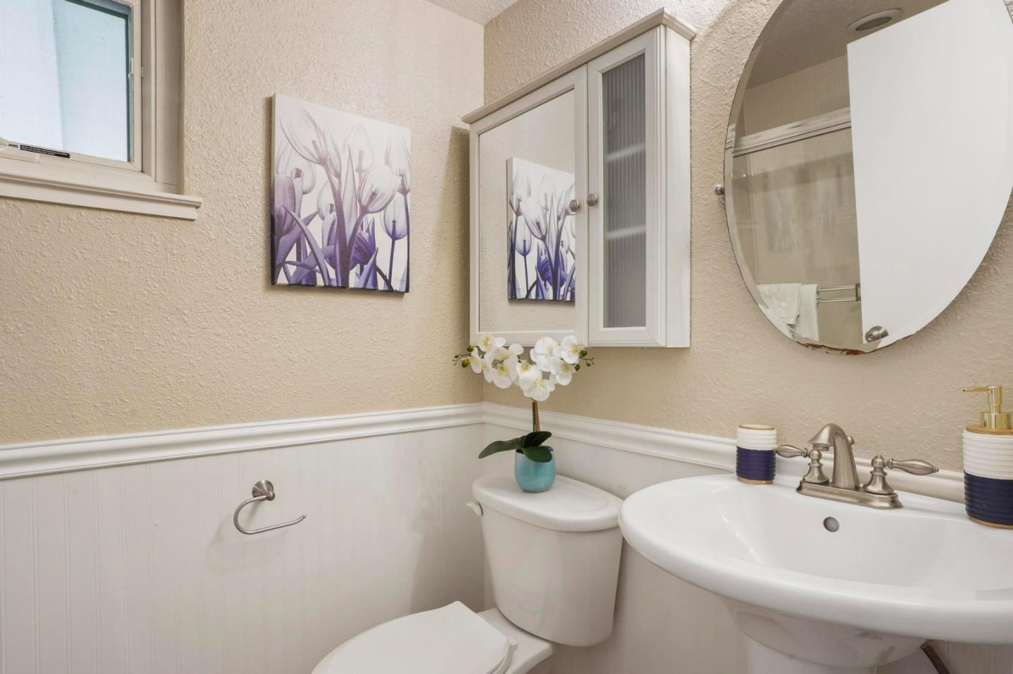 120 Castleton Court San Ramon, CA 94583 - Photo 15 of 30 a bathroom with a toilet a sink and mirror