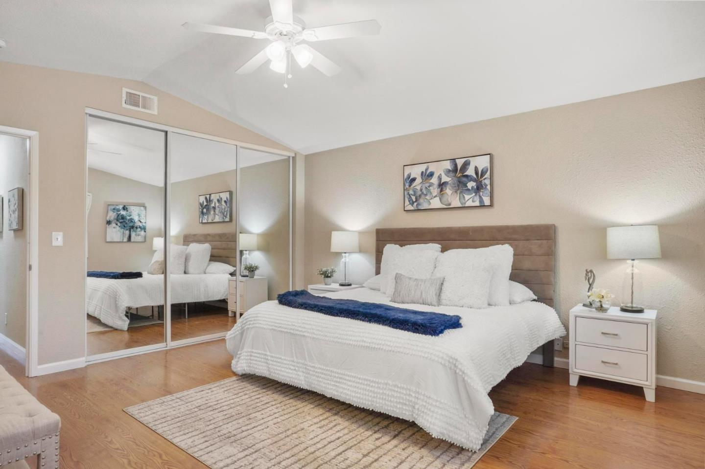 120 Castleton Court San Ramon, CA 94583 - Photo 18 of 30 a bedroom with a large bed and a chandelier