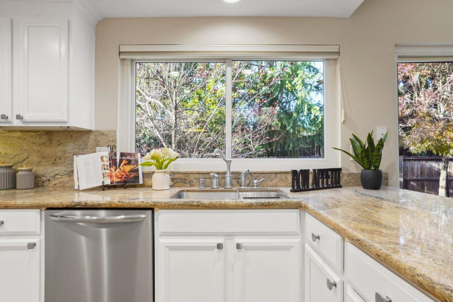 120 Castleton Court San Ramon, CA 94583 - Photo 9 of 30 a kitchen with granite countertop a sink and a window