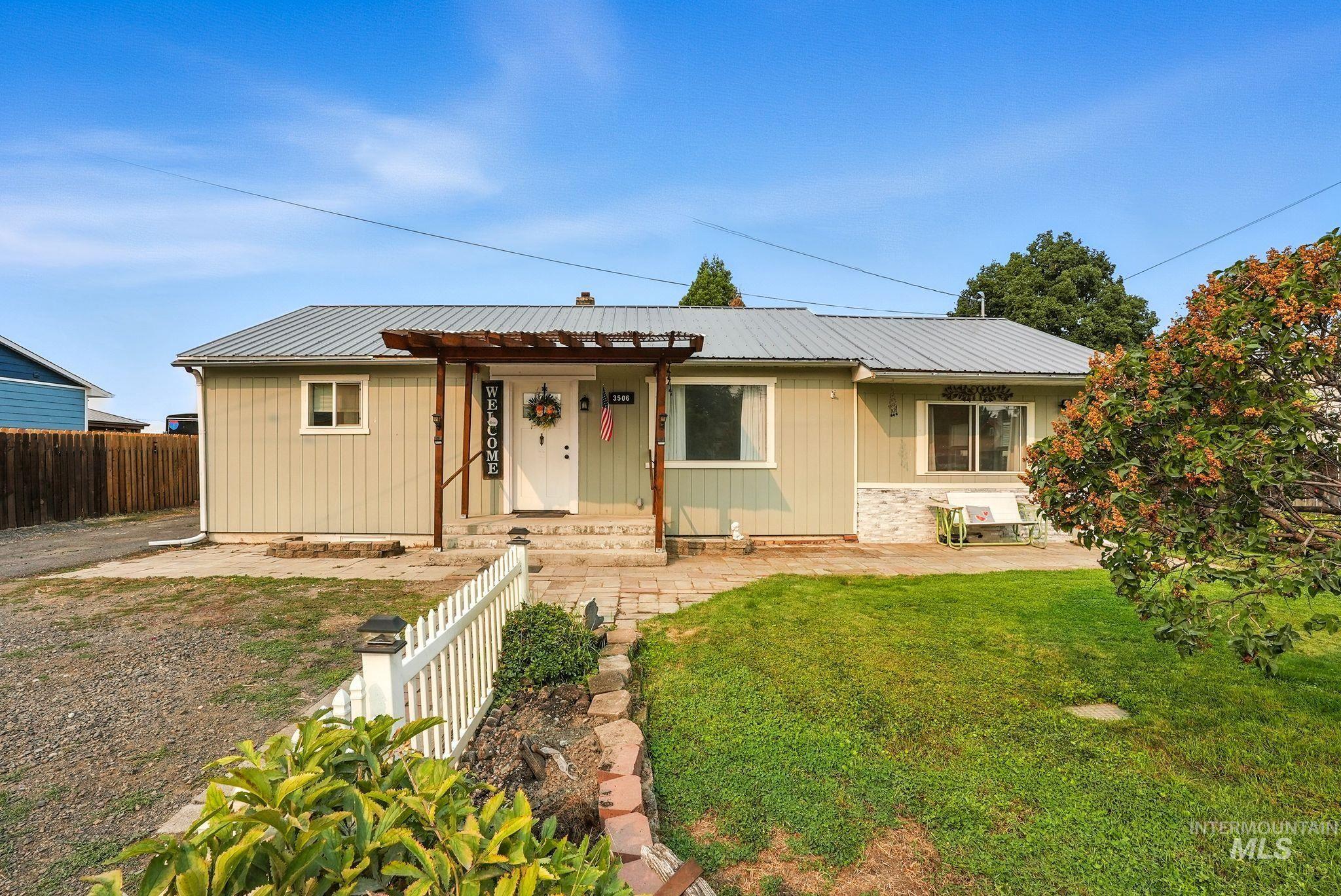 3506 10th Street Lewiston, ID 83501 - Photo 1 of 40 Ranch-style home featuring a patio and a metal roof