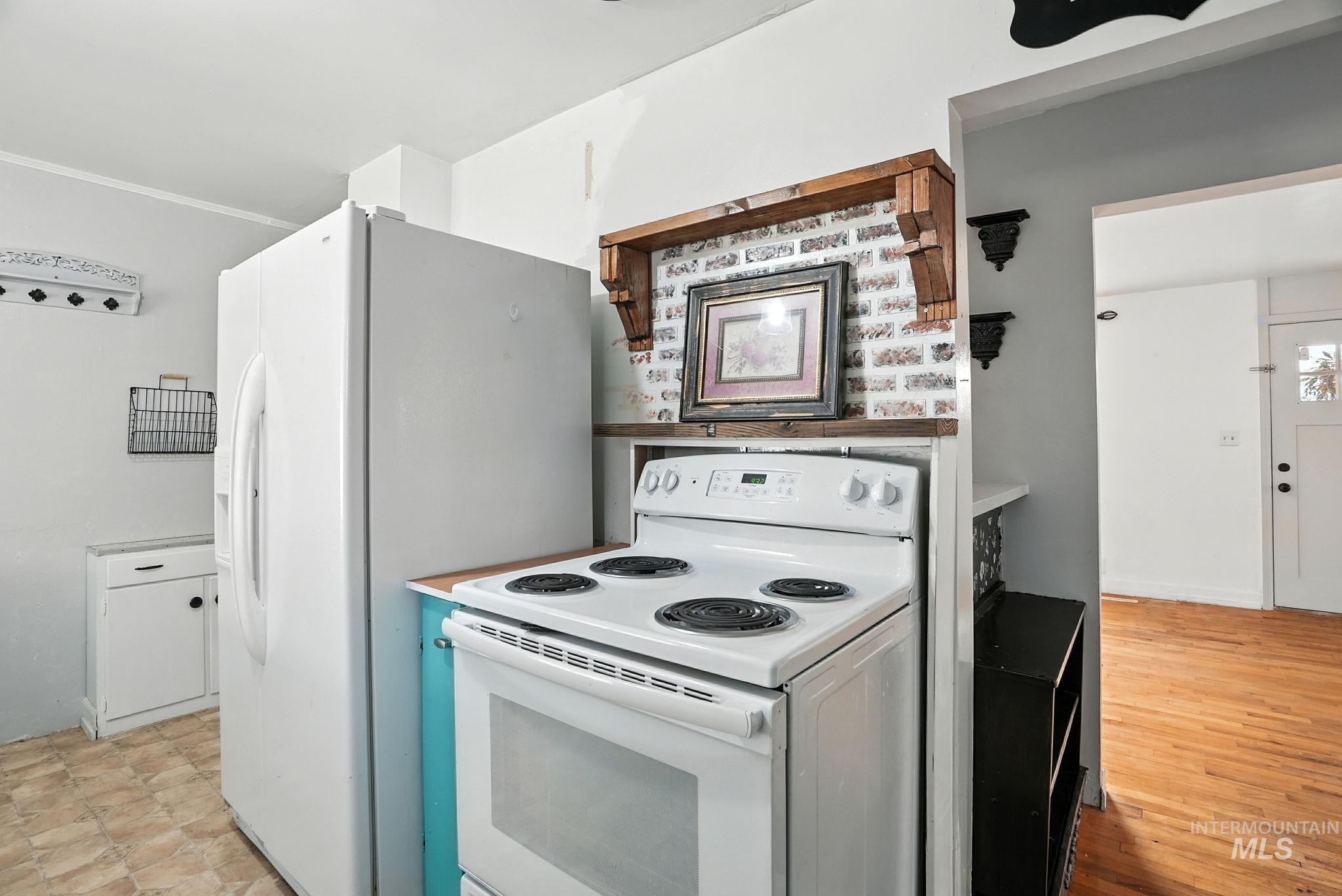 3506 10th Street Lewiston, ID 83501 - Photo 15 of 40 Kitchen with white electric range and light countertops
