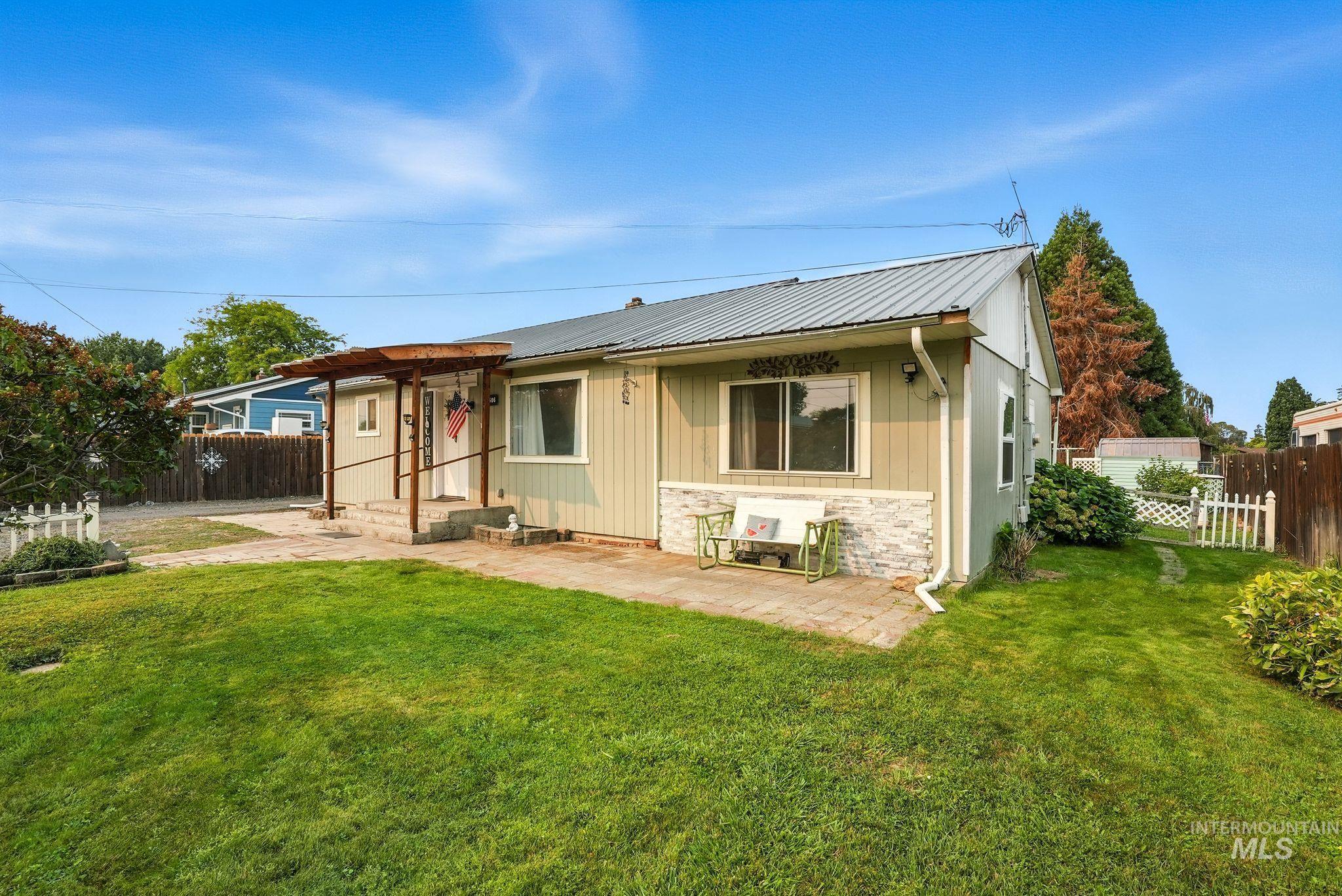 3506 10th Street Lewiston, ID 83501 - Photo 2 of 40 View of front of property with a patio, board and batten siding, a metal roof, and stone siding
