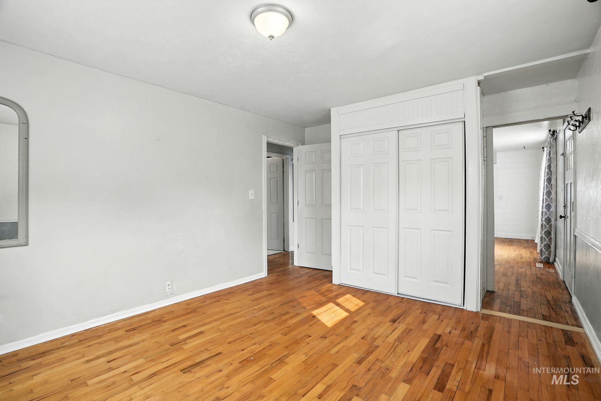 3506 10th Street Lewiston, ID 83501 - Photo 23 of 40 Unfurnished bedroom with light wood-type flooring and a closet