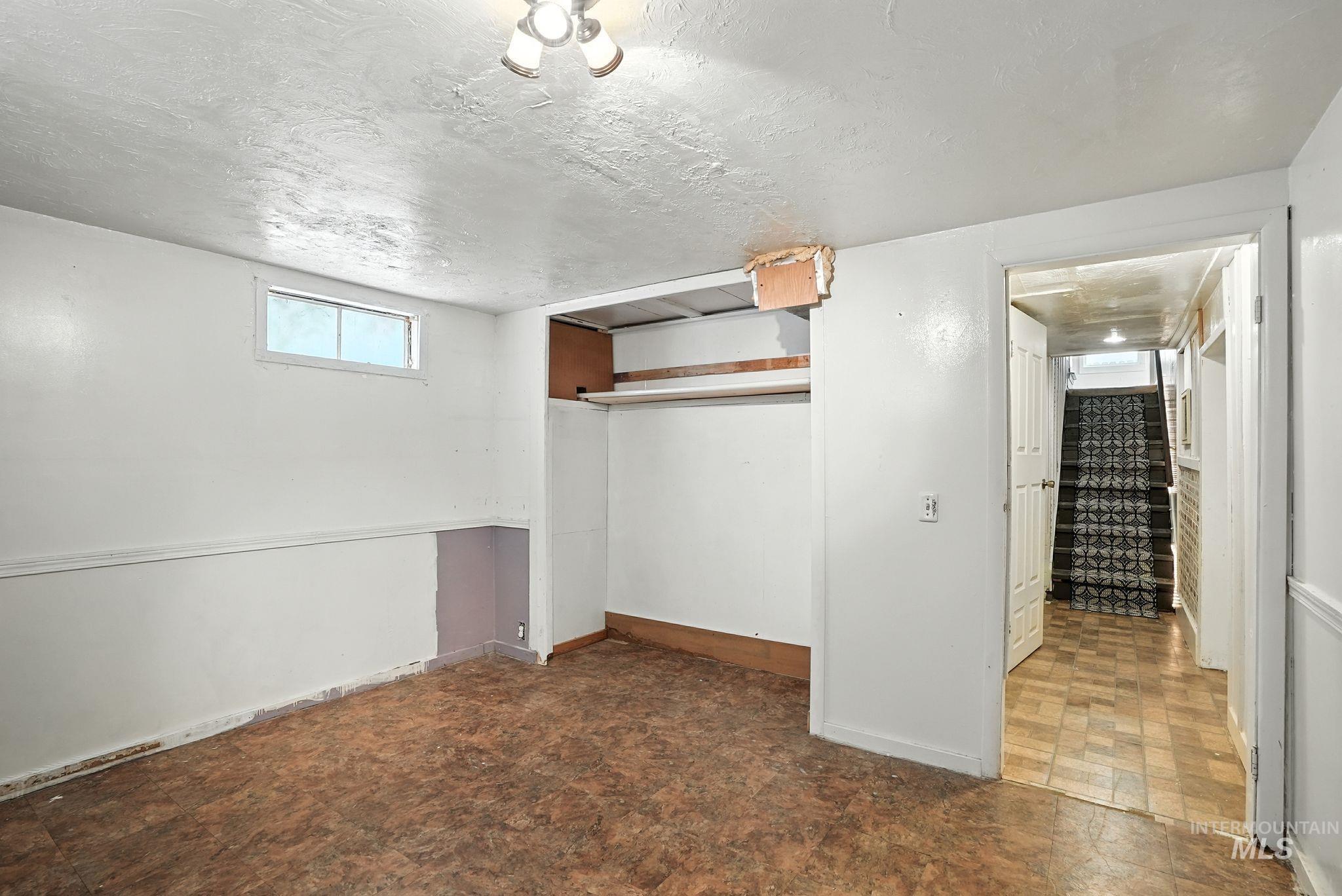 3506 10th Street Lewiston, ID 83501 - Photo 31 of 40 Basement featuring a textured ceiling and baseboards