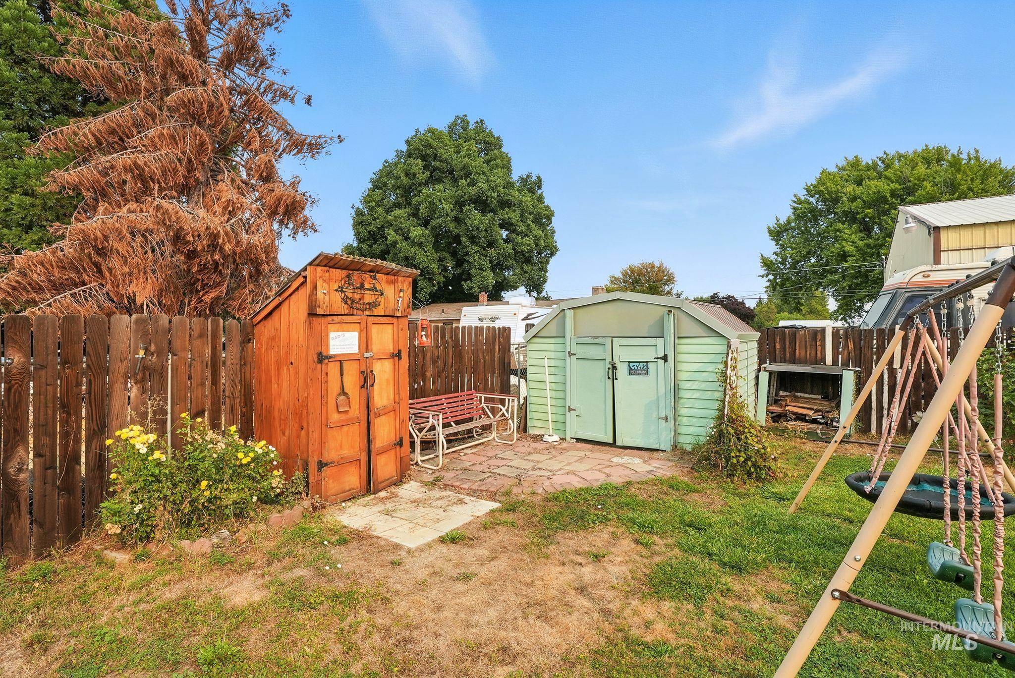 3506 10th Street Lewiston, ID 83501 - Photo 38 of 40 Fenced backyard with a storage shed and a patio