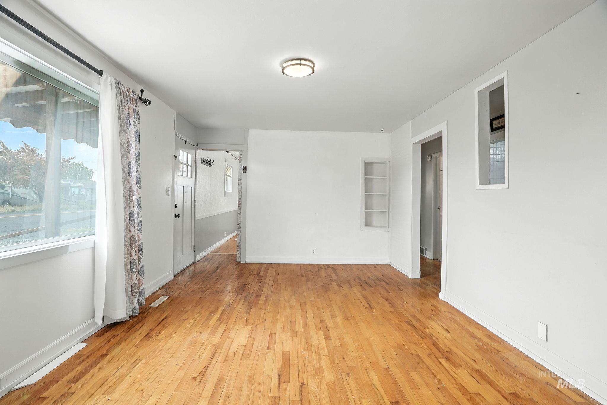 3506 10th Street Lewiston, ID 83501 - Photo 8 of 40 Empty room with light wood finished floors and baseboards