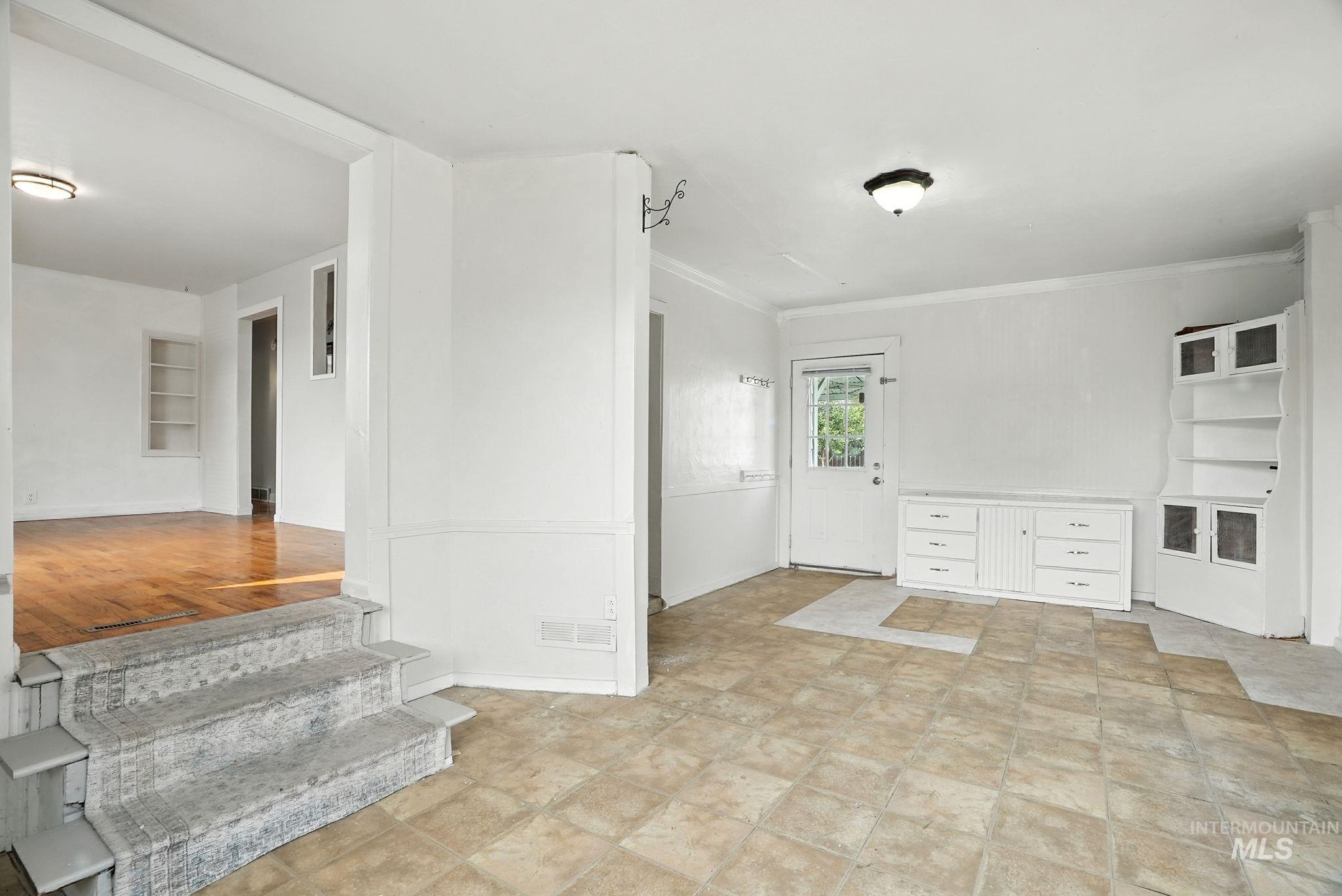 3506 10th Street Lewiston, ID 83501 - Photo 10 of 40 Spare room featuring ornamental molding and baseboards