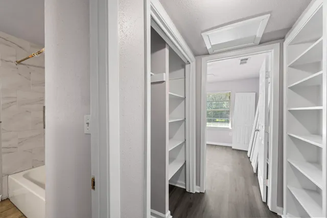 a view of entryway with wooden floor and stairs