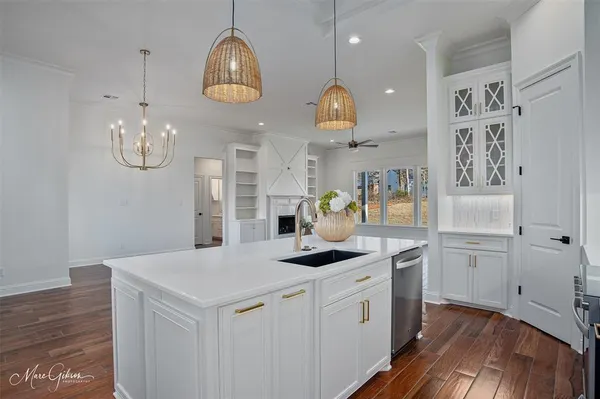 a kitchen with cabinets and stainless steel appliances