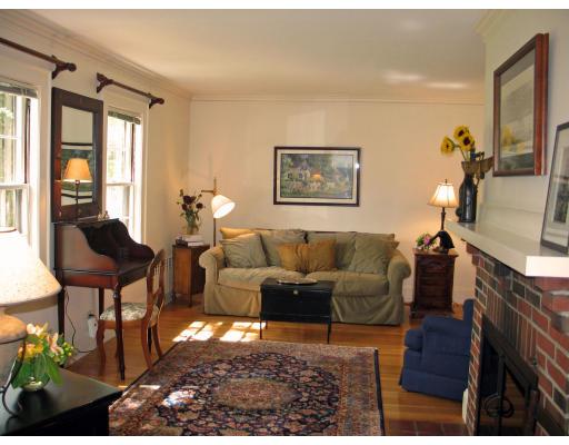 53 Dexter Road Lexington, MA 02420 - Photo 2 of 12 a living room with furniture and a fireplace