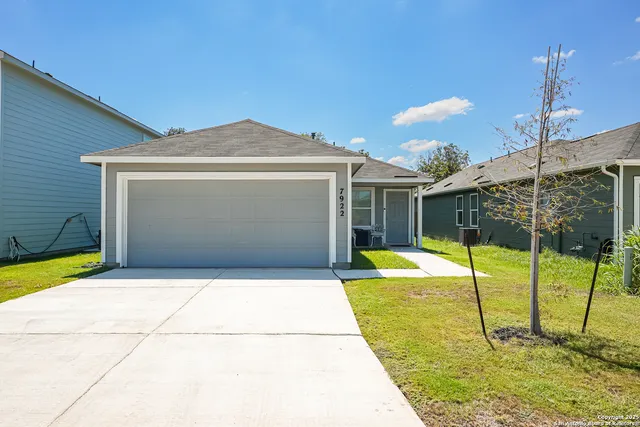 a view of a backyard with table and chairs