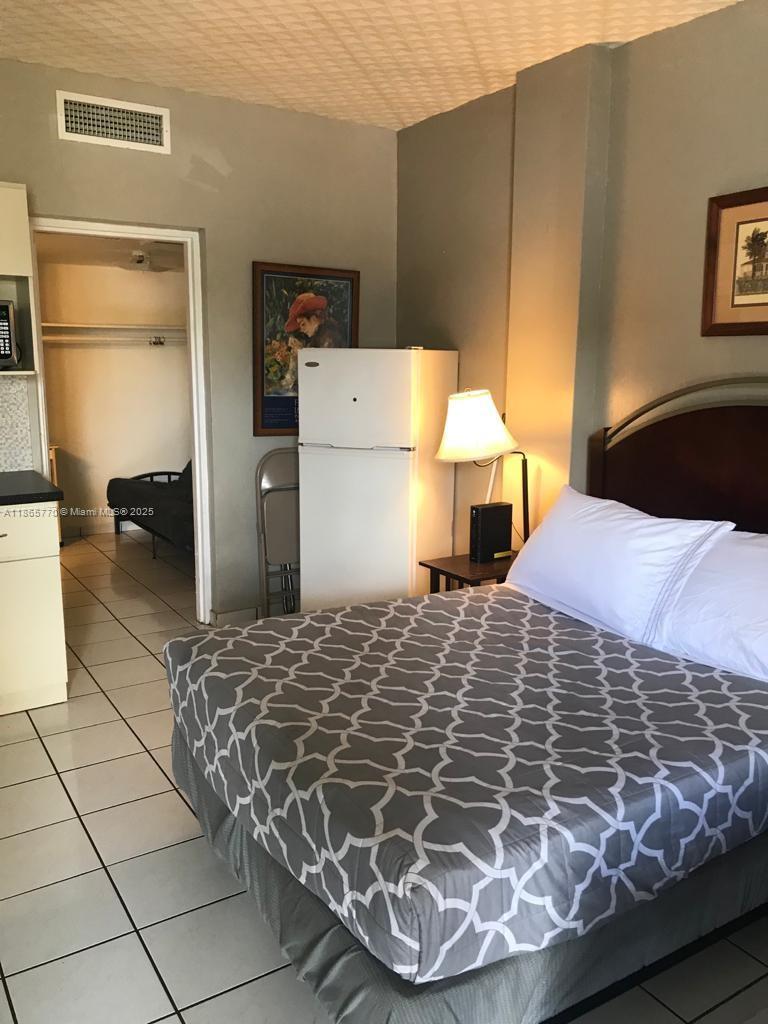 a bedroom with a bed and a table