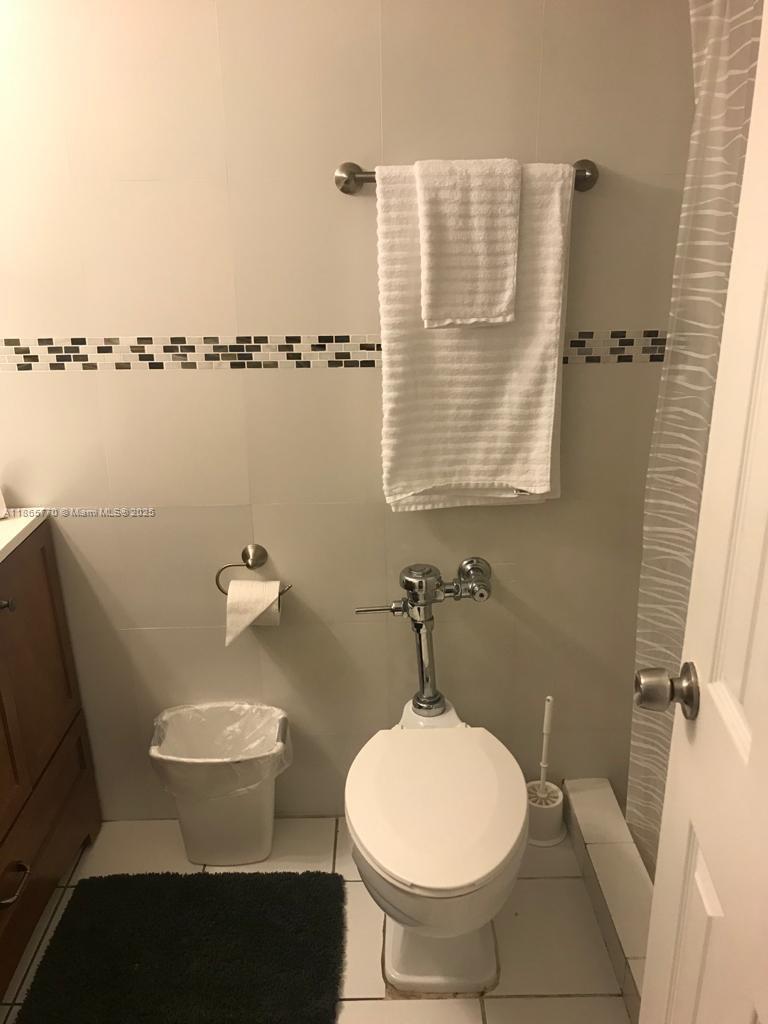 26 Diplomat Parkway, Unit 2233 Hallandale Beach, FL 33009 - Photo 7 of 7 a bathroom with a toilet and a sink