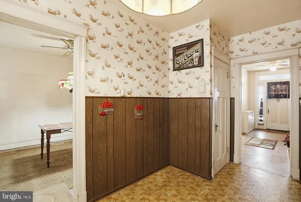 a view of a hallway with a dining area