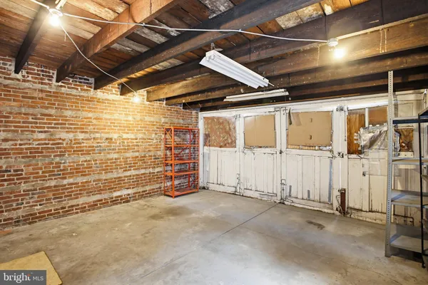 a view of an empty room with wooden walls