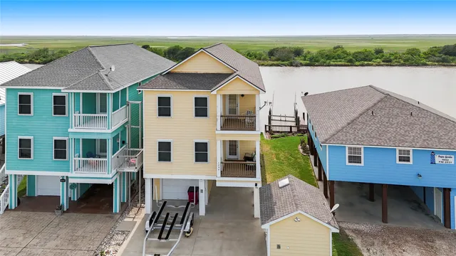 a aerial view of a house with a yard