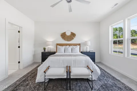 a bed room with a bed and window