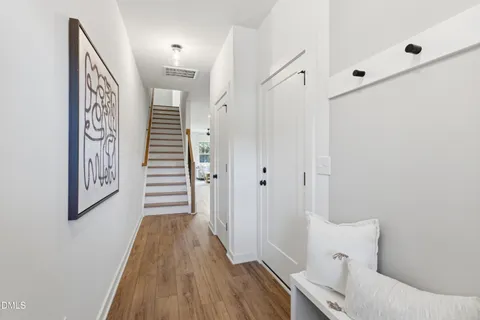 a bathroom with a shower sink vanity mirror and toilet