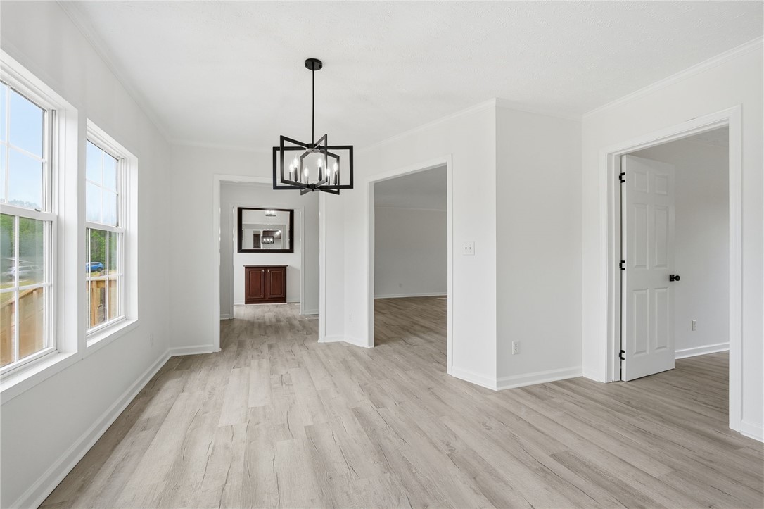 112 Sir Francis Drake Way Liberty, SC 29657 - Photo 33 of 42 Bright, open-concept dining area with ample natural light and elegant flooring awaits your personal touch.