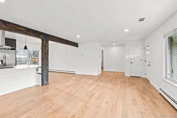 a kitchen with stainless steel appliances a refrigerator and cabinets