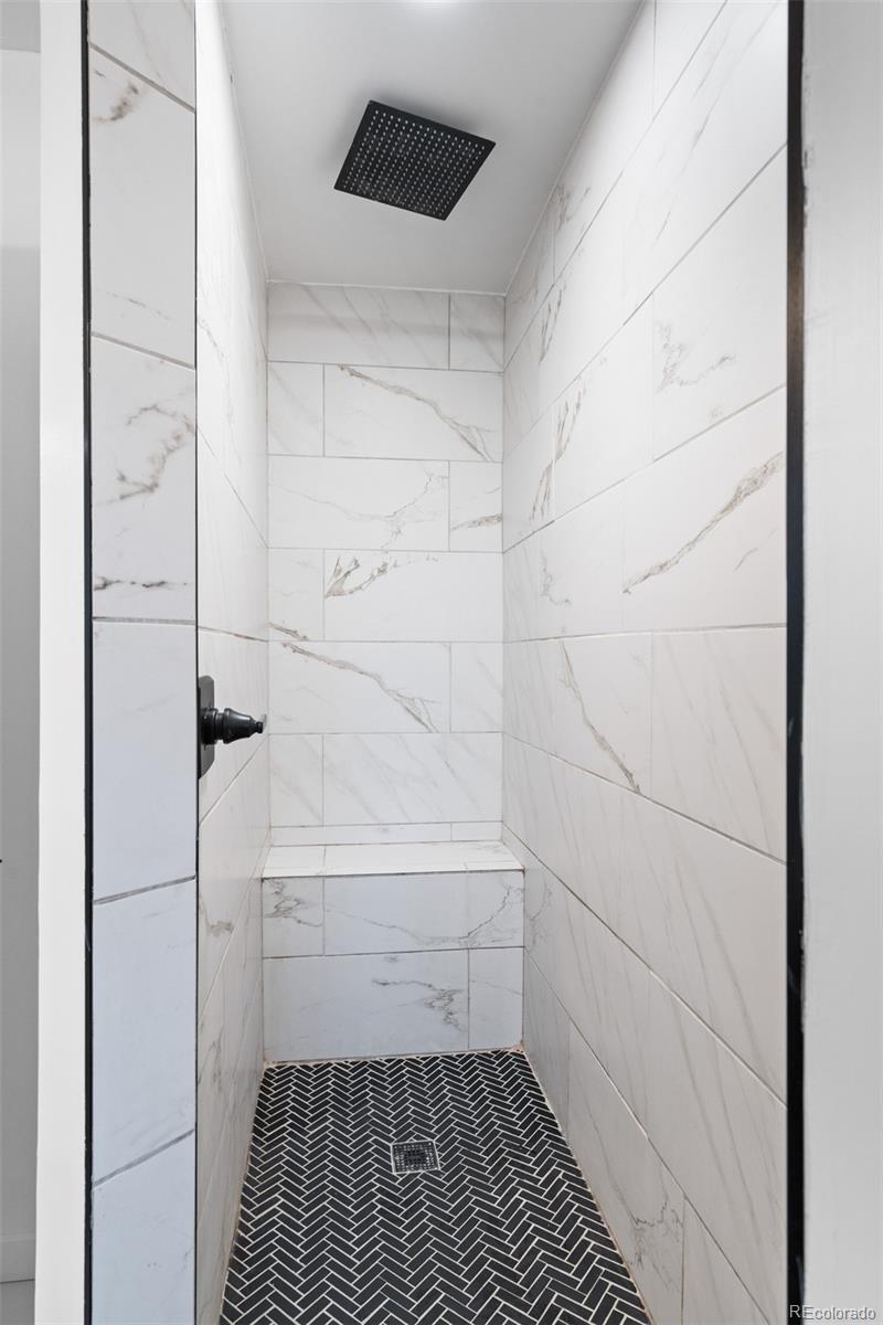 1440 Northwestern Road Longmont, CO 80503 - Photo 29 of 41 a bathroom with a bathtub and a shower