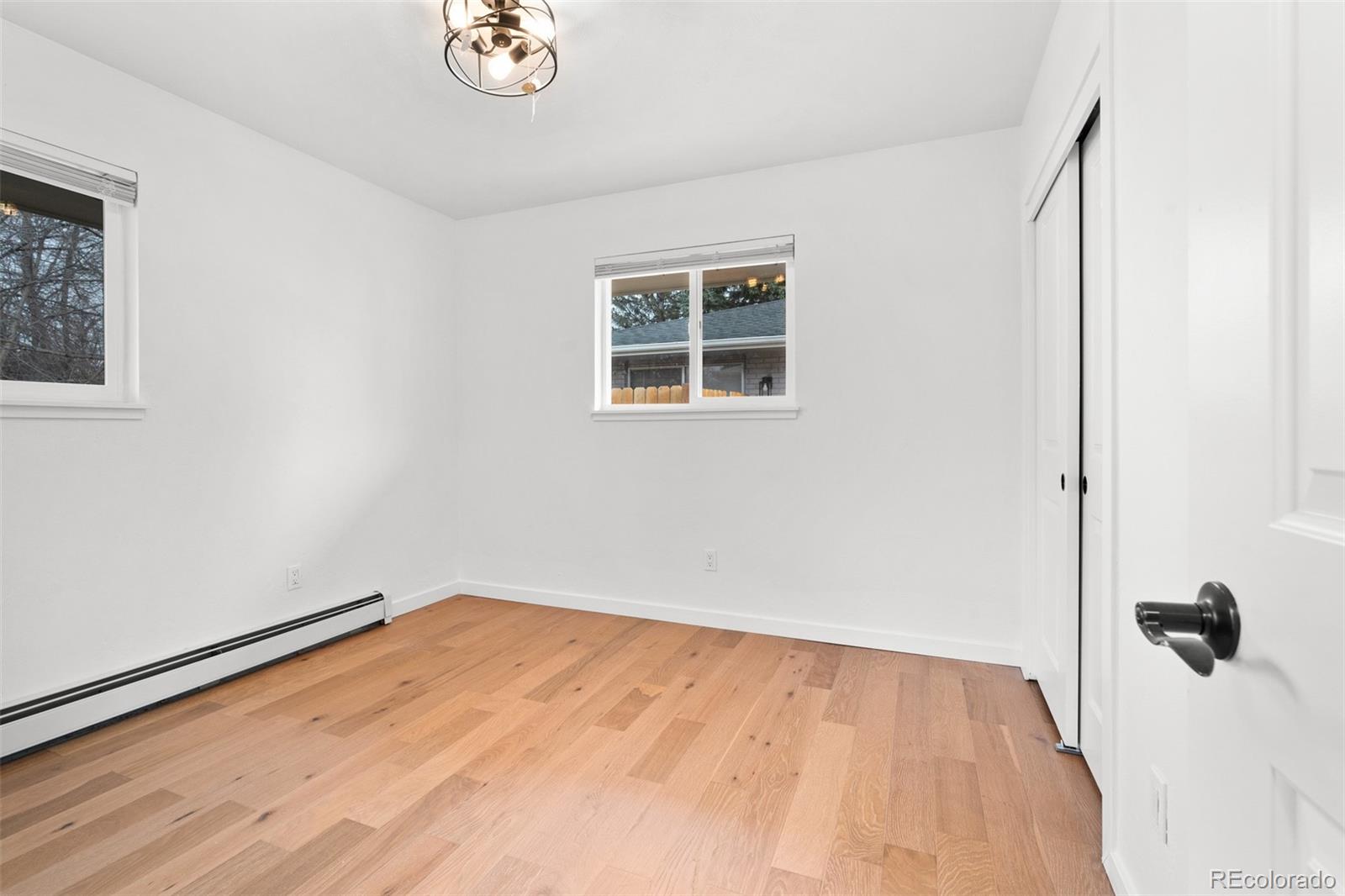 1440 Northwestern Road Longmont, CO 80503 - Photo 39 of 41 a view of a room with wooden floor and cabinet