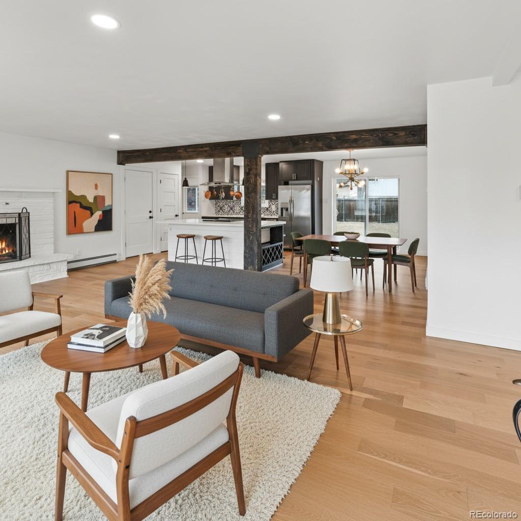 1440 Northwestern Road Longmont, CO 80503 - Photo 4 of 41 a living room with furniture and a wooden floor