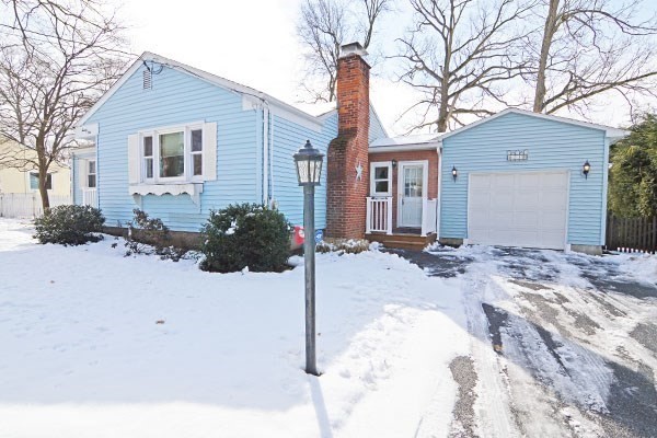 21 Hadley Street Springfield, MA 01118 - Photo 1 of 34 a view of a house with snow on the road