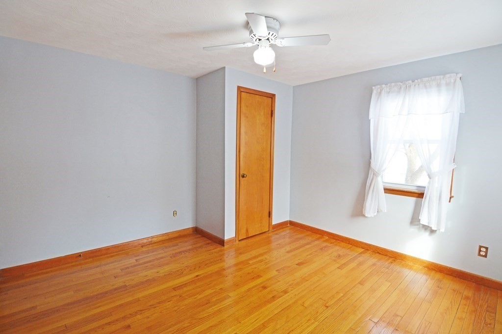 21 Hadley Street Springfield, MA 01118 - Photo 14 of 34 wooden floor in an empty room with a window