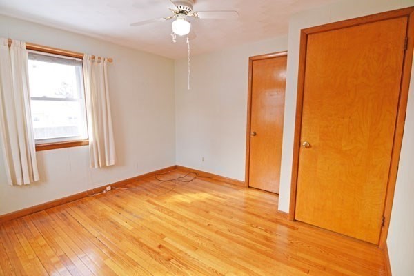 21 Hadley Street Springfield, MA 01118 - Photo 16 of 34 a view of empty room with wooden floor and fan