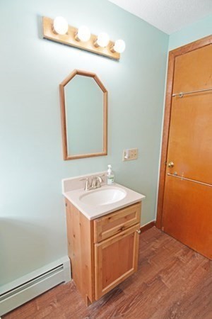 21 Hadley Street Springfield, MA 01118 - Photo 17 of 34 a utility room with a sink a mirror and vanity