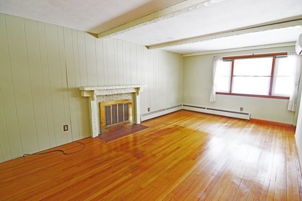 21 Hadley Street Springfield, MA 01118 - Photo 9 of 34 a view of empty room with wooden floor and fan