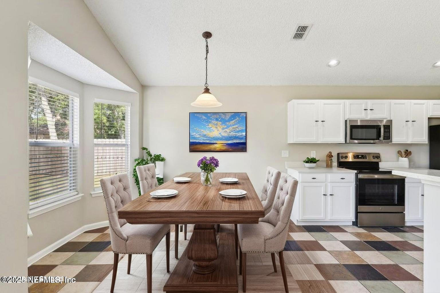 86123 Red Holly Place Yulee, FL 32097 - Photo 11 of 36 a view of a dining room with furniture window and wooden floor