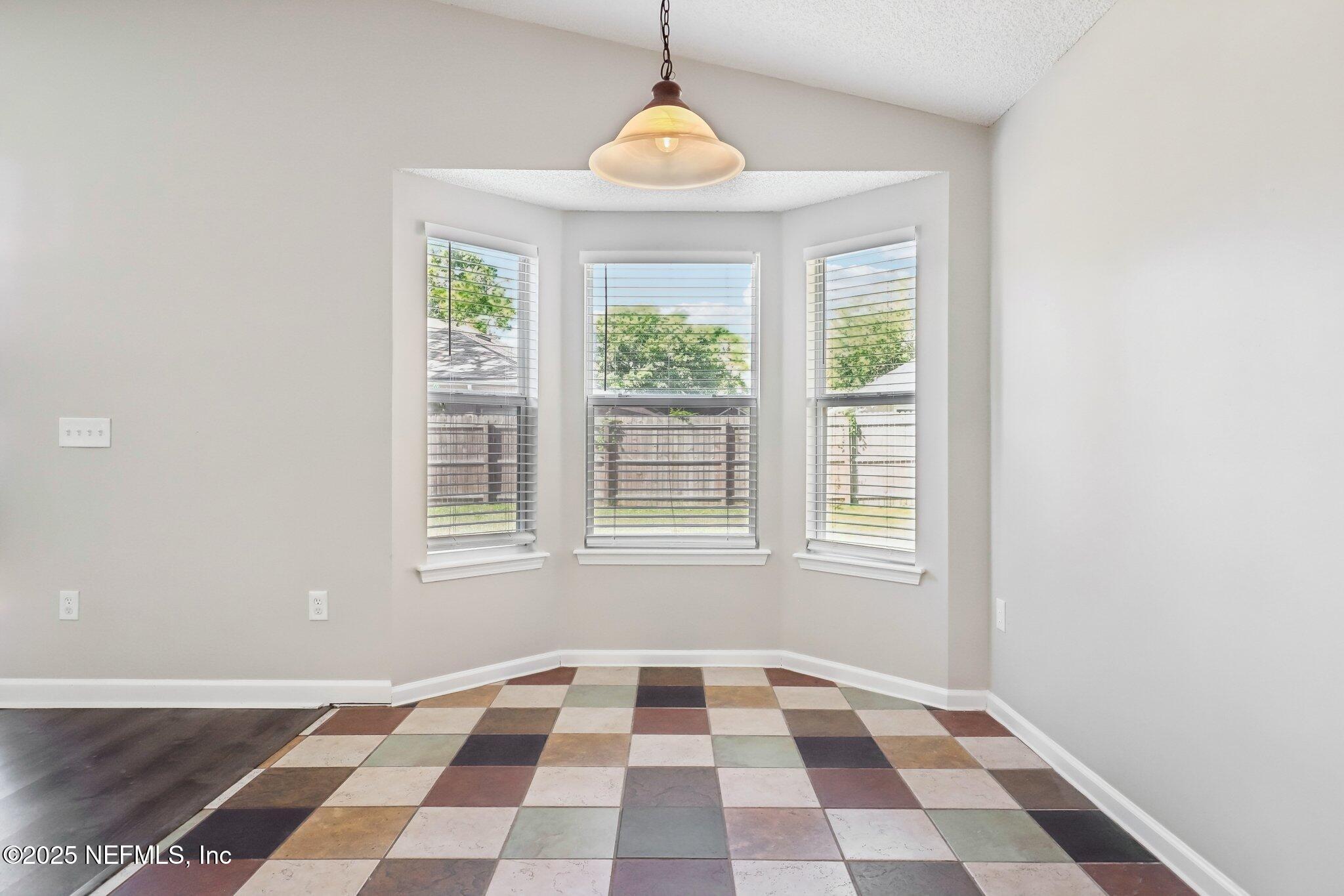 86123 Red Holly Place Yulee, FL 32097 - Photo 12 of 36 a black and white checkered floor with a outdoor space