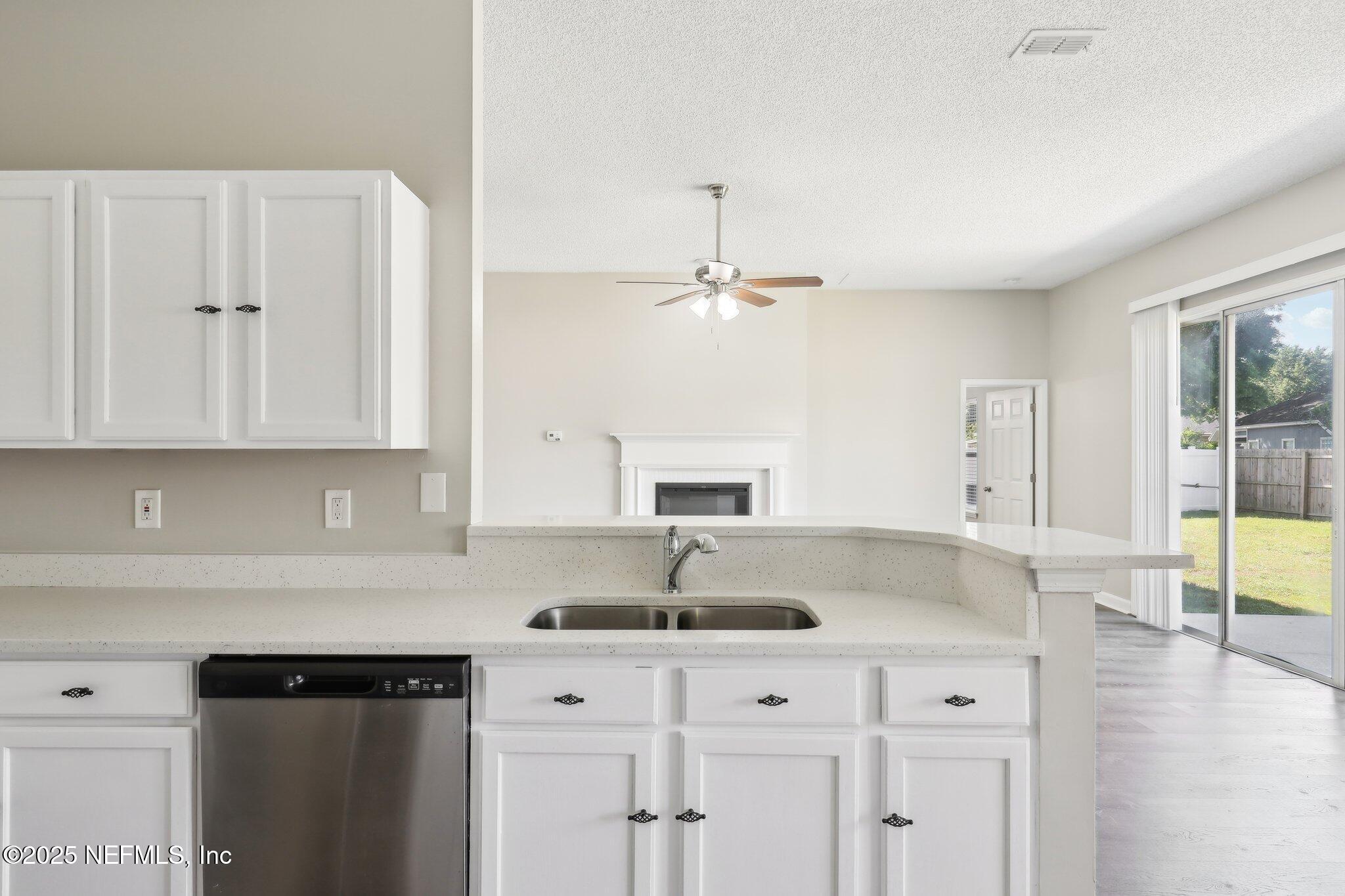 86123 Red Holly Place Yulee, FL 32097 - Photo 16 of 36 a white kitchen with sink and window