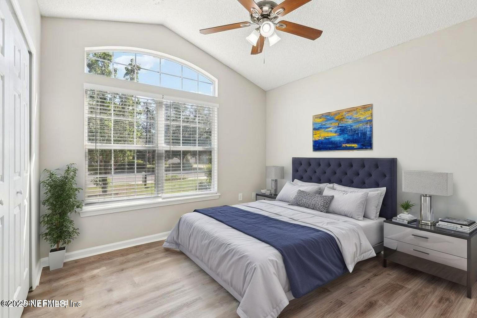 86123 Red Holly Place Yulee, FL 32097 - Photo 20 of 36 a bedroom with a large bed and a window