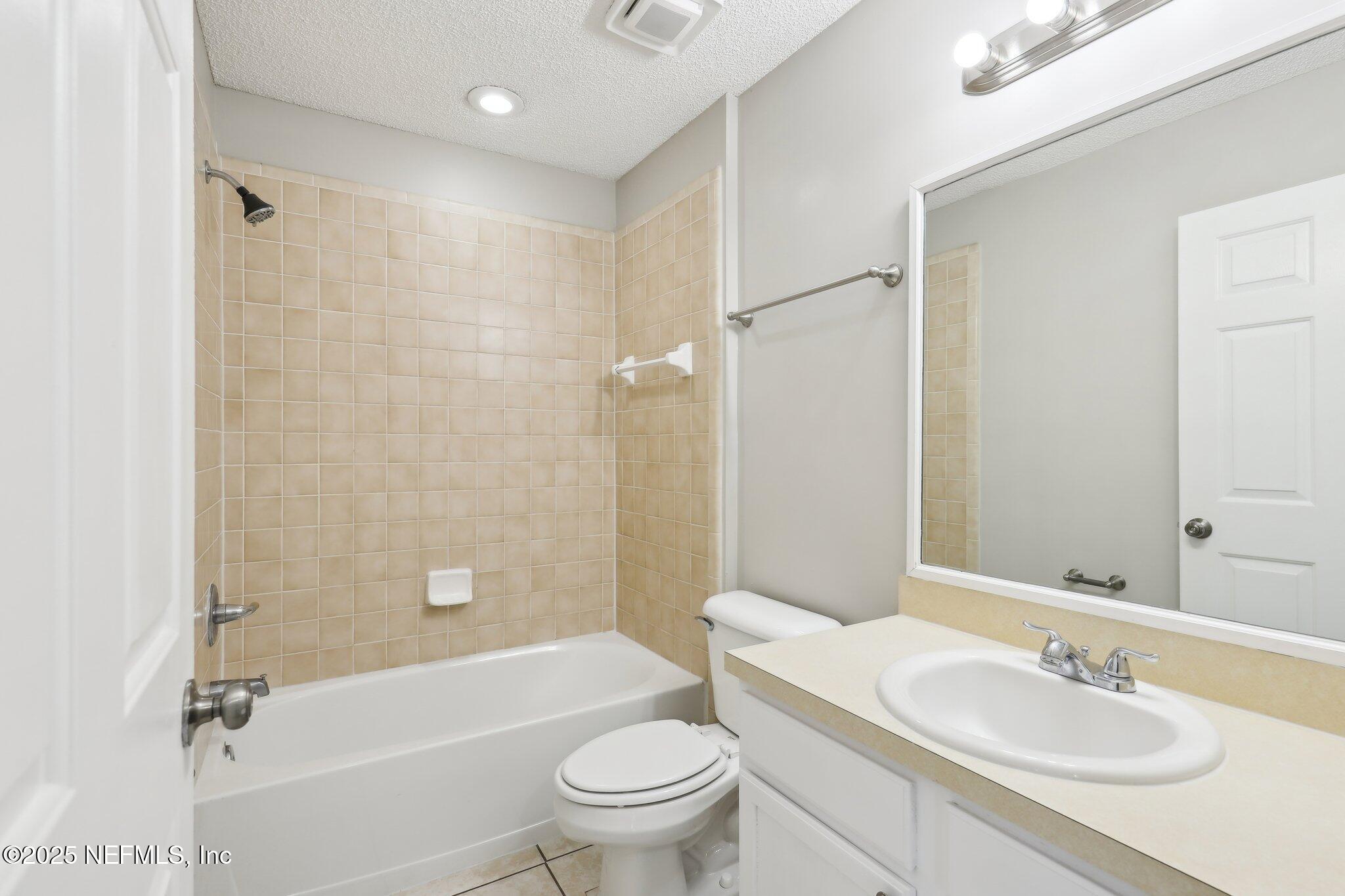 86123 Red Holly Place Yulee, FL 32097 - Photo 22 of 36 a bathroom with a sink toilet and shower
