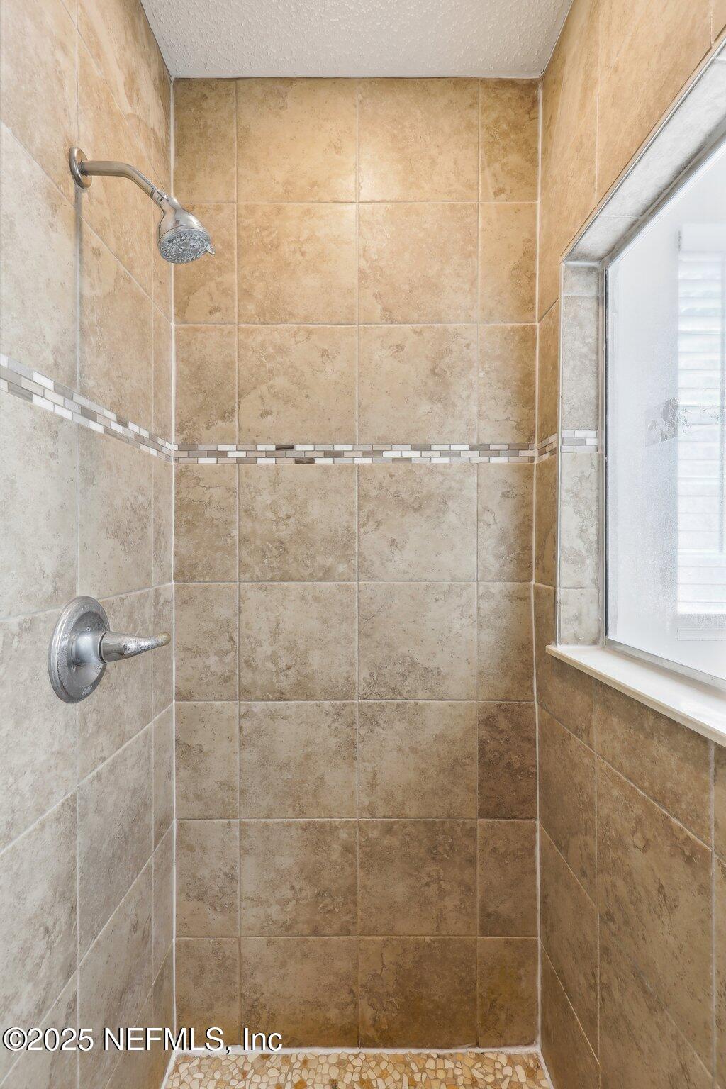 86123 Red Holly Place Yulee, FL 32097 - Photo 30 of 36 a bathroom with a shower