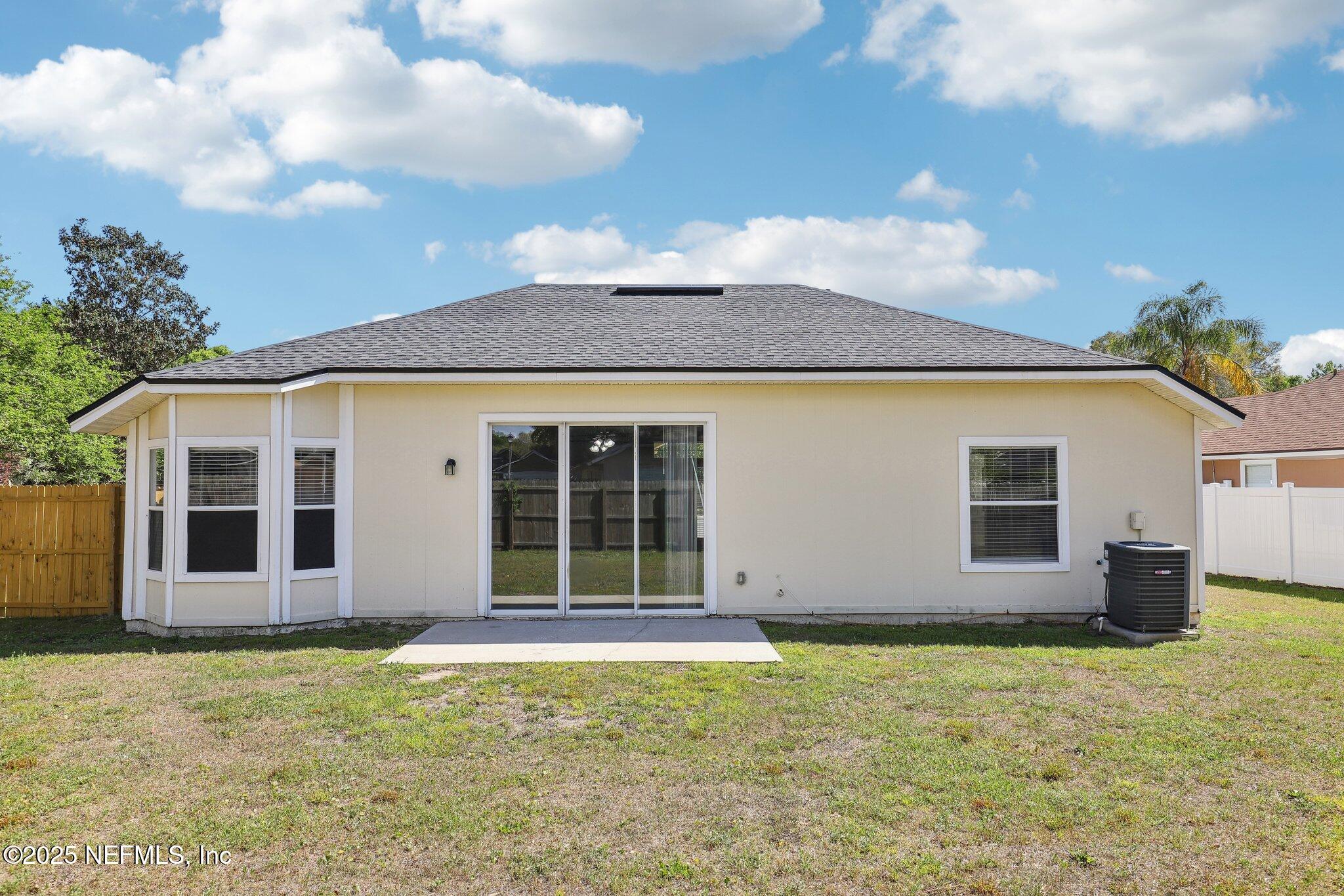 86123 Red Holly Place Yulee, FL 32097 - Photo 35 of 36 a view of a house with a garden