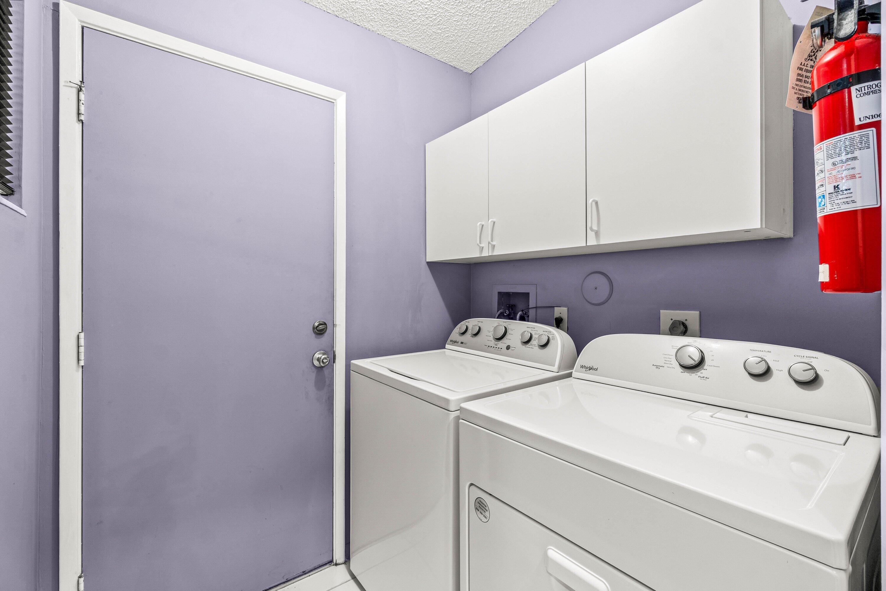 8191 Whispering Palm Drive Boca Raton, FL 33496 - Photo 16 of 34 a utility room with dryer and washer