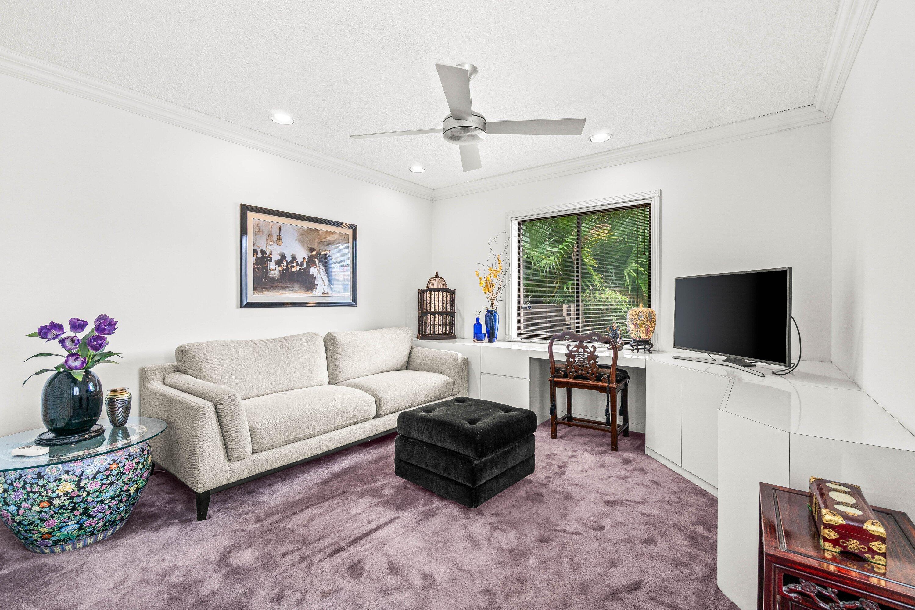 8191 Whispering Palm Drive Boca Raton, FL 33496 - Photo 21 of 34 a living room with furniture and a flat screen tv