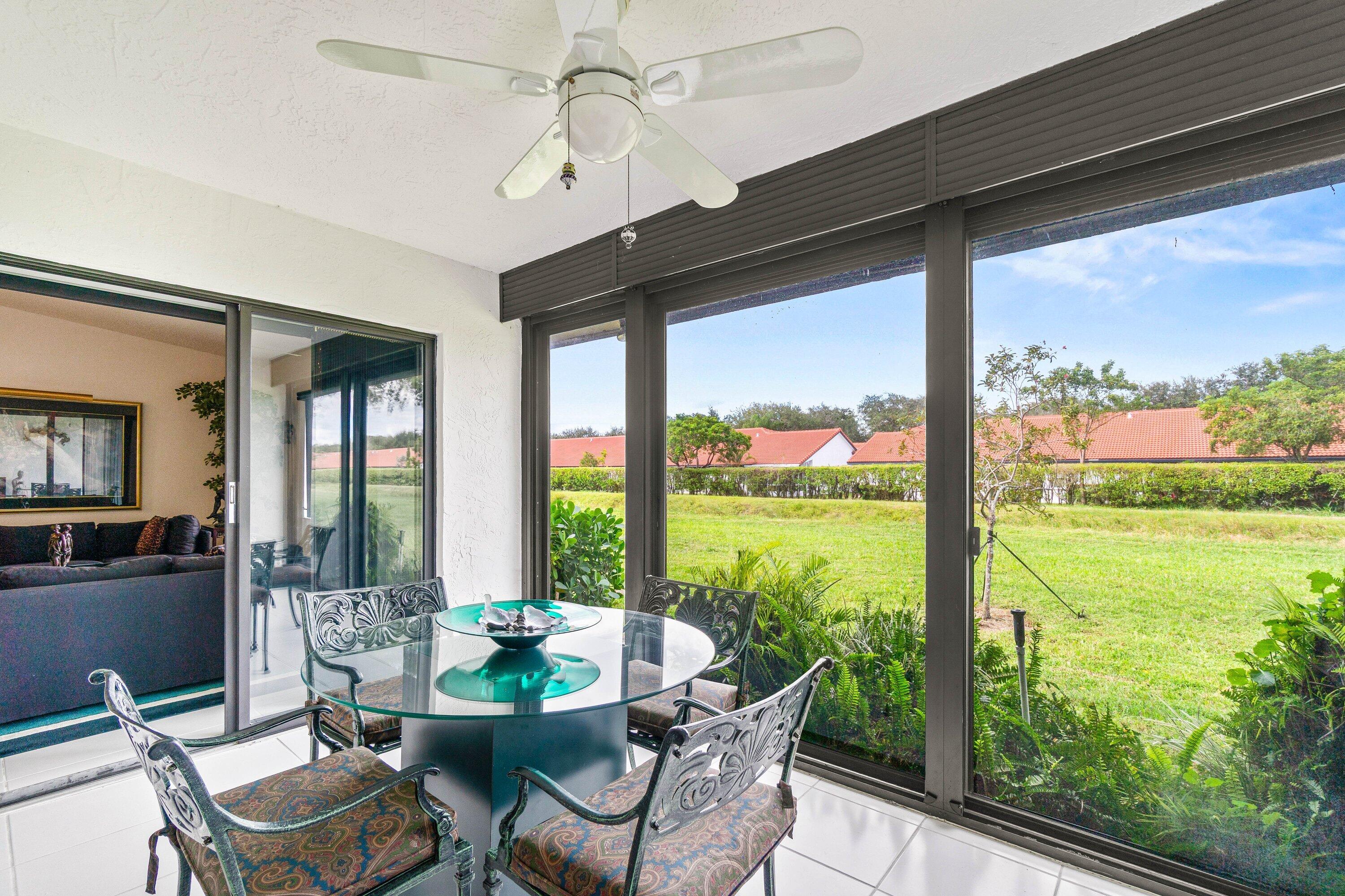8191 Whispering Palm Drive Boca Raton, FL 33496 - Photo 25 of 34 a view of a porch with furniture and garden